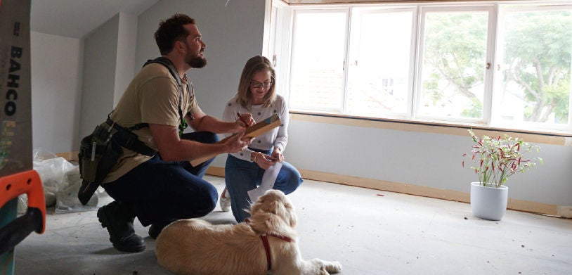 woman checking out a property with an engineer